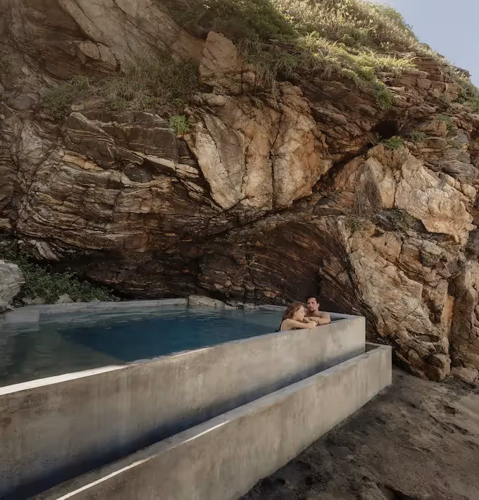 Private pool built into the cliff offering an exclusive relaxation experience at La Valise Mazunte Hotel.