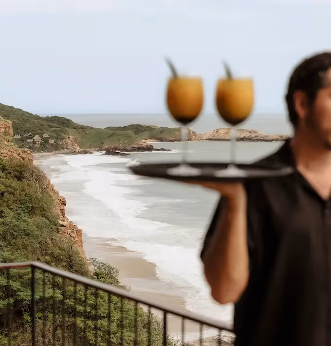 Refreshing cocktails served on the terrace with a sweeping sea view at La Valise Mazunte Hotel restaurant.