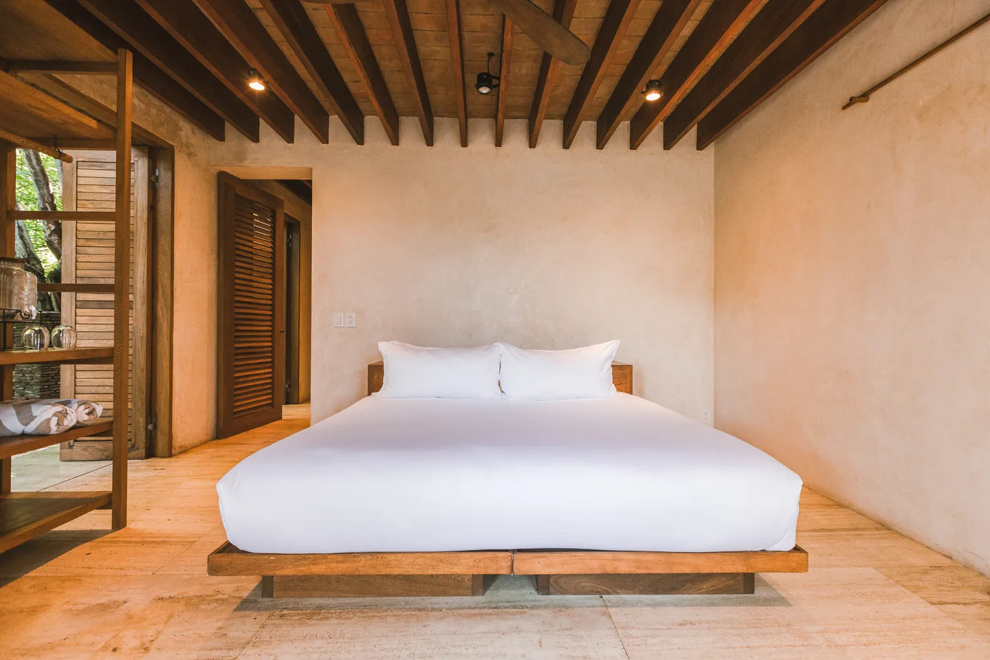 CASA CUACHALALA - ALL ROOMS — La Valise Mazunte: King bed beneath a wooden beam ceiling in Suite Selva — La Valise Mazunte